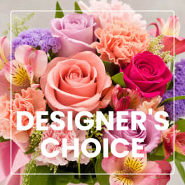 Mixed bouquet of pink, peach, and purple flowers with roses and carnations