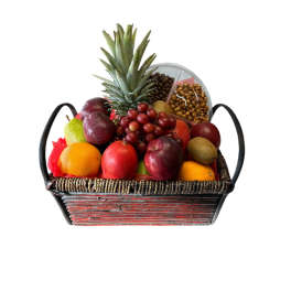 Fruit basket with pineapple, grapes, oranges, and assorted fruit in a woven tray