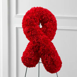 Red carnation ribbon on a stand
