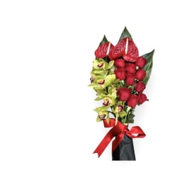 Bouquet of red roses and green orchids with a red ribbon