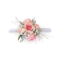Pink rose wrist corsage with white baby's breath on a silver band