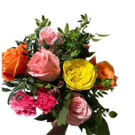 Mixed bouquet of roses in pink, orange, and yellow