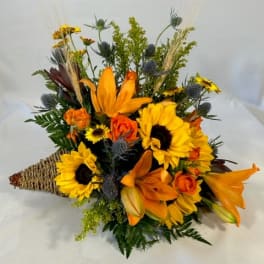 Orange and yellow mixed bouquet with sunflowers and lilies
