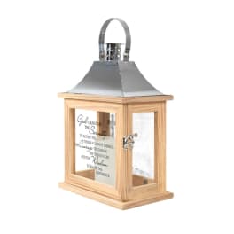 Wooden lantern with a metal top and glass panels