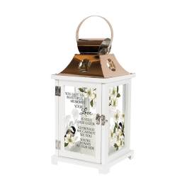 White memorial lantern with floral panels and a sympathy message