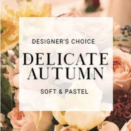 Soft pastel floral arrangement with roses and yellow blooms