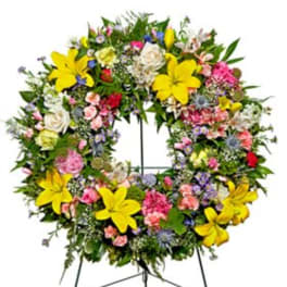 Large mixed flower wreath with yellow lilies and pink blooms