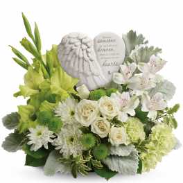White and green sympathy arrangement with a memorial plaque and angel wing ornament