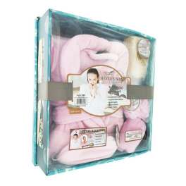 Spa gift set in a clear box with white bath items and a loofah scrub