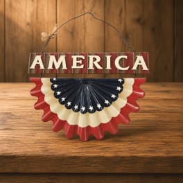 Patriotic hanging sign with "AMERICA" and red, white, and blue bunting