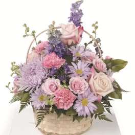 Pastel flower basket with roses, daisies, and carnations