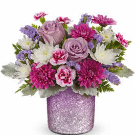 Pink and white mixed bouquet in a textured lavender vase