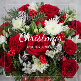 Red roses and white chrysanthemums with pinecones and berries