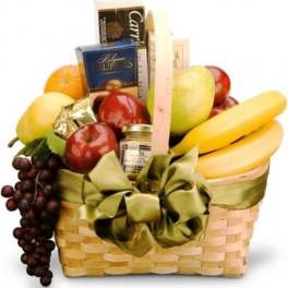 Gift basket with fruit, chocolates, and a ribbon bow