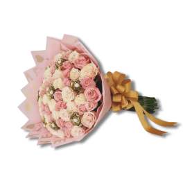 Bouquet of pink and cream roses wrapped in pink paper with a gold ribbon