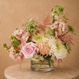 Pink and white mixed bouquet in a clear glass vase