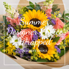 Wrapped bouquet with sunflowers, roses, daisies, and purple filler flowers