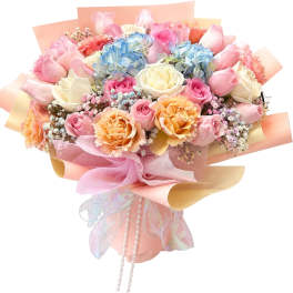 Pastel bouquet of roses, hydrangeas, and baby’s breath with ribbon wrap
