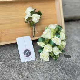 White rose boutonniere and matching rose corsage with green ribbon