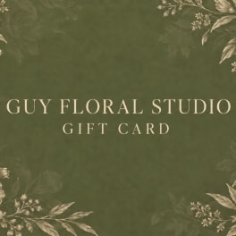 Green floral studio gift card with decorative botanical border