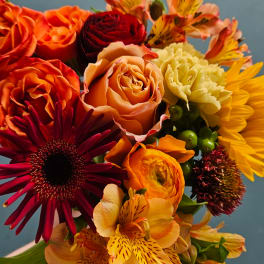 Colorful bouquet with roses, gerbera daisies, carnations, and alstroemeria