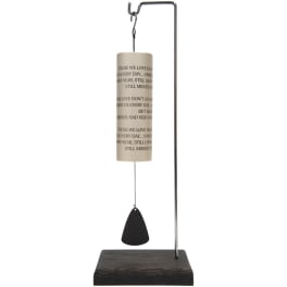 Memorial wind chime with a hanging metal tube and black clapper on a wooden base