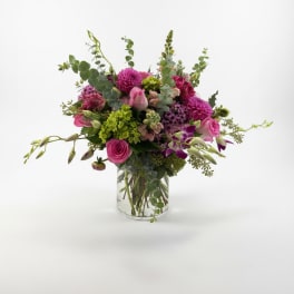 Pink and purple mixed bouquet in a clear glass vase
