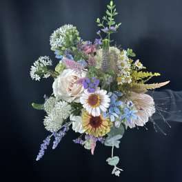 Mixed pastel bouquet with daisies, roses, and airy filler flowers