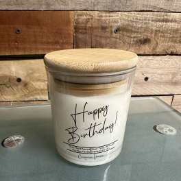 Birthday candle in a glass jar with a bamboo lid