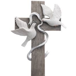 Wooden cross with two white doves and a silver ribbon