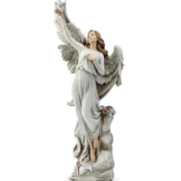 Decorative angel statue in a white robe with raised wings
