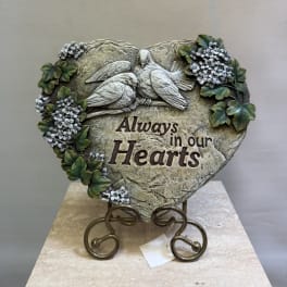 Heart-shaped memorial plaque with two birds and floral accents