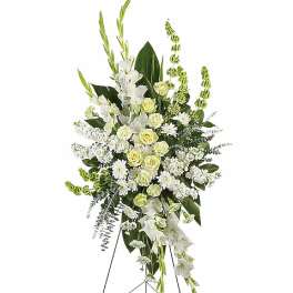 Tall white and pale green standing floral spray on an easel