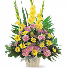 Yellow gladiolus and pink daisies in a cream vase