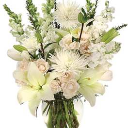 White lilies and pale roses in a glass vase