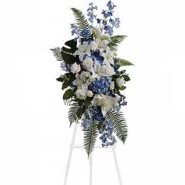 Tall white and blue floral spray on a stand