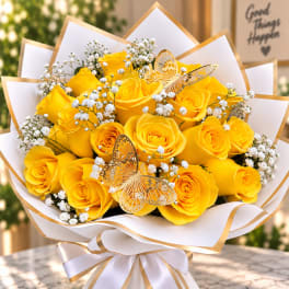 Yellow rose bouquet with white baby's breath and butterfly decorations