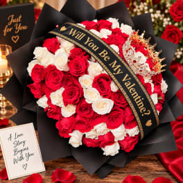 Red and white rose bouquet with a black ribbon and crown decoration