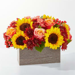 Sunflower and rose arrangement in a rectangular wooden box