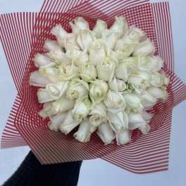 Bouquet of white roses wrapped in red striped paper