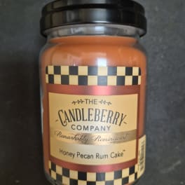 Jar candle labeled Honey Pecan Rum Cake