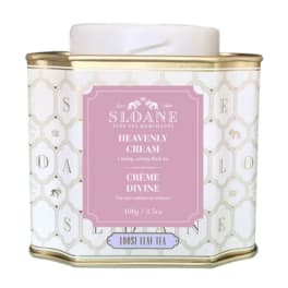 Decorative tin of loose leaf tea with a pink label and gold trim