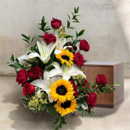 Bouquet of red roses, white lilies, and sunflowers with greenery