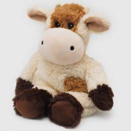 Plush cow stuffed animal sitting on a white background