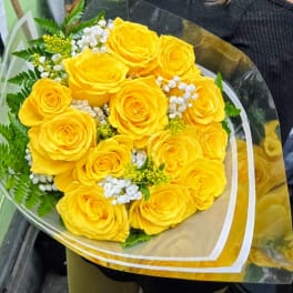 Bouquet of yellow roses with white filler flowers