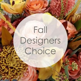Fall bouquet with orange and pink flowers and a white center bloom