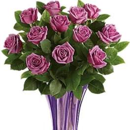 Purple rose bouquet in a tall purple glass vase