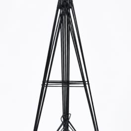 Black metal easel stand on a white background