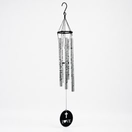 Hanging metal wind chime with a black cross and LOVE medallion