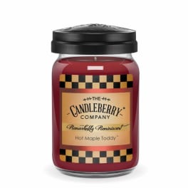 Red jar candle with a black lid and labeled front